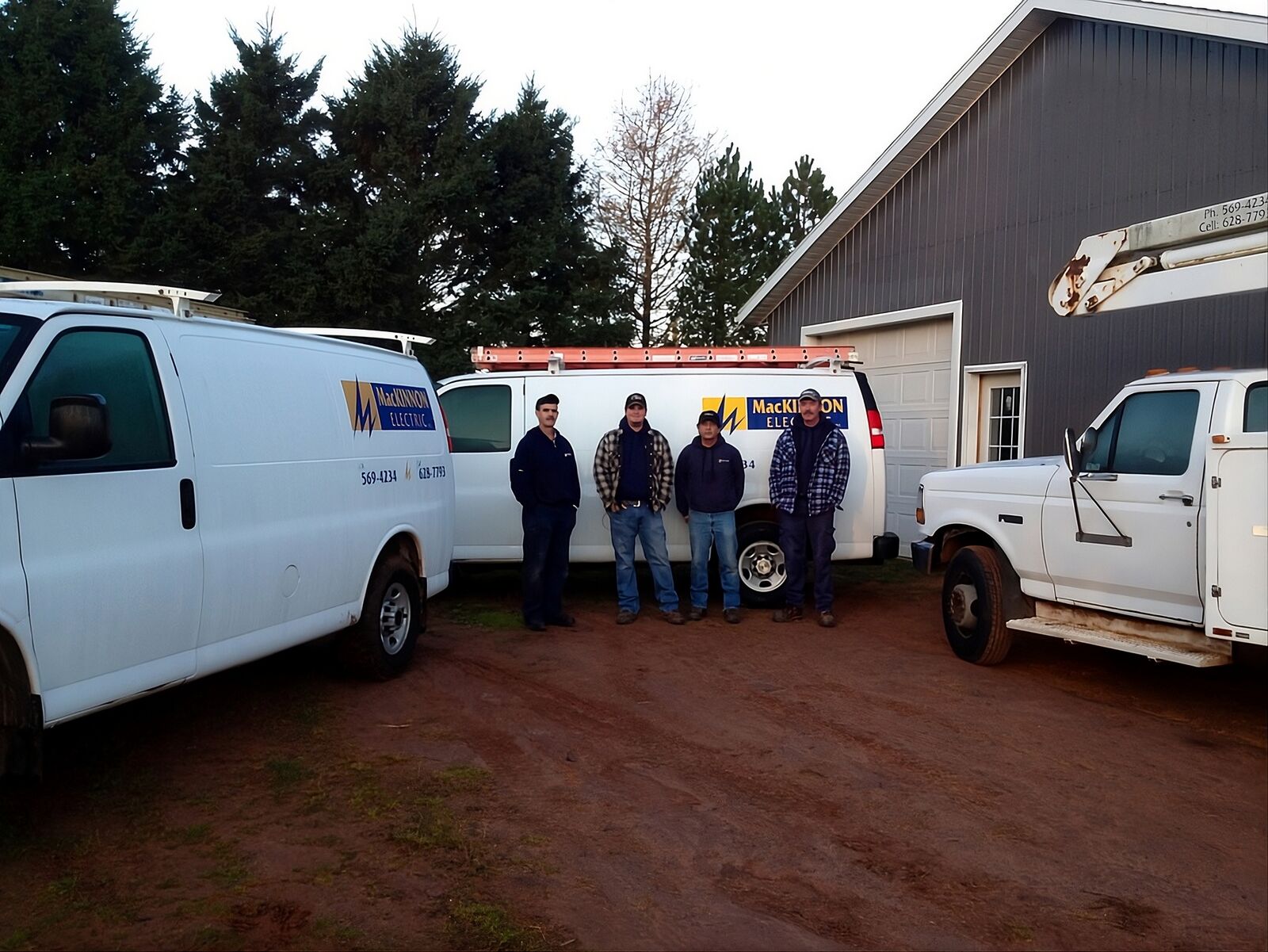 The MacKinnon Electric crew in front of their service vans